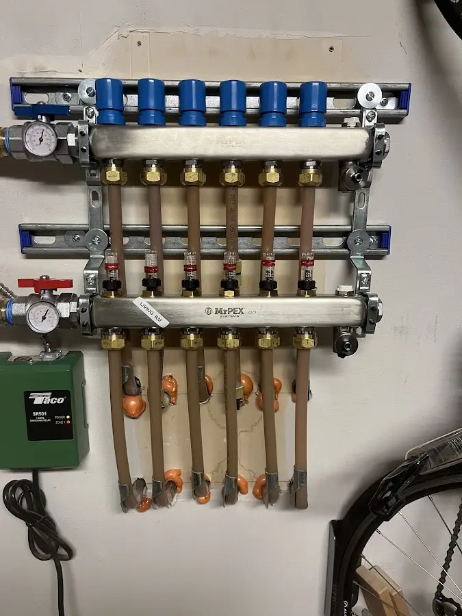 Plumber performing Water Heater Repair at a residential property in Edna